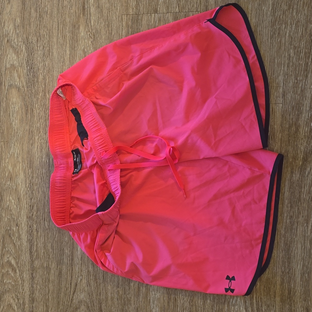 Mens pink Under Armour polyester shorts.